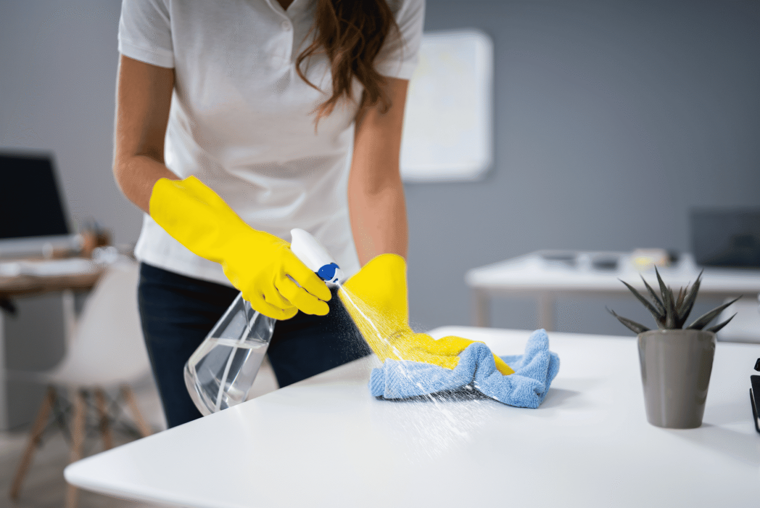 A woman cleaning the table